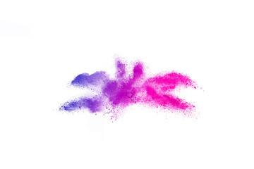 Freeze motion of purple color powder exploding on white background.