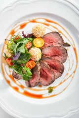 Medium Rare Roast Beef with Green Mix and Potato Balls