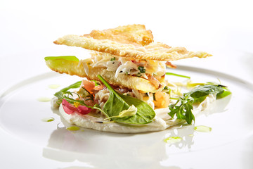 Crab napoleon with pike caviar sauce closeup
