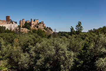 Fototapeta na wymiar Escalona mudejar Palace over river trees landscape. Toledo, Spain.
