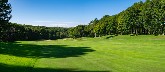 Golf Course with beautiful green field. Golf course with a rich green turf beautiful scenery.