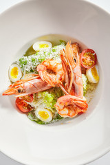 Delicious caesar with argentinian shrimps top view