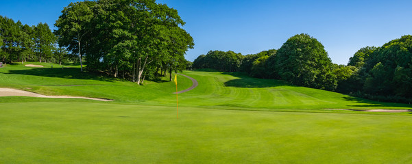 Panorama View of Golf Course with beautiful putting green. Golf course with a rich green turf beautiful scenery.