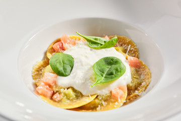 Ravioli with spinach, concasse and cheese espuma