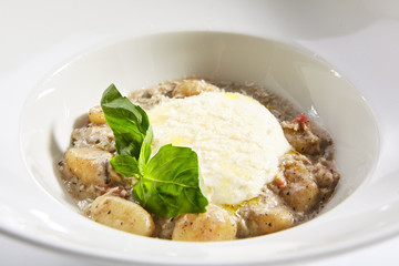 Gnocchi in mushroom sauce with cheese espuma