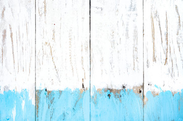 Close-up  of  background from old planks colored with white and blue  paint . Copy space , top view .