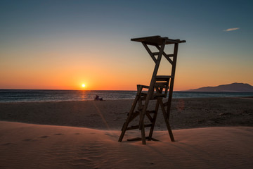 A lifeguard chair on Los Lances beach at sunset, Tarifa, Cadiz province, Andalusia, Spain