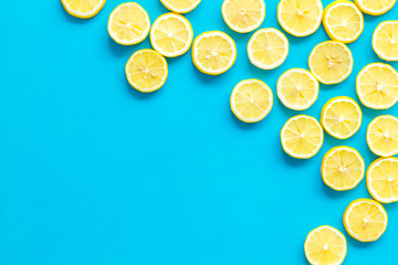 Lemon slices frame on yellow background top view space for text