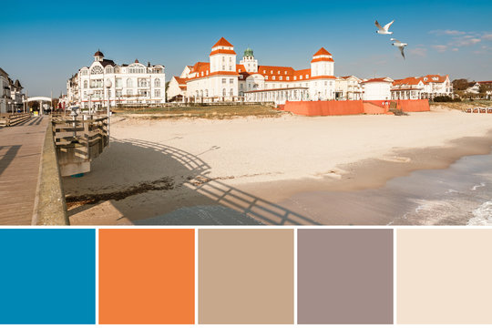 Color matching complementary palette with blue, orange, and beige colors from image of traditional German seasude architecture in Binz resort on Ruegen island, Germany.