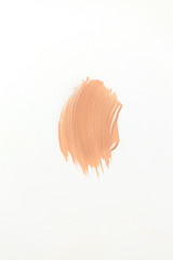 Fototapeta premium Beige skin tone smudge on white background