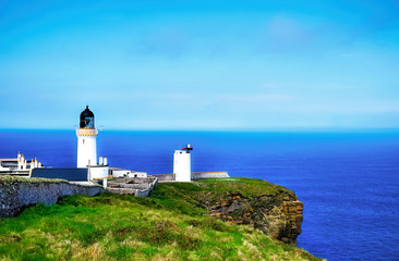 Fototapeta na wymiar Dunnet Head lighthouse and the Pentland Firth