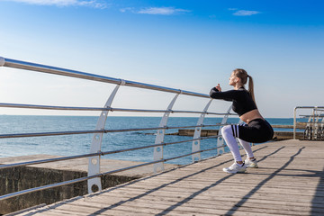Woman doing warming up exercises and squats.