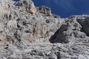 Fototapeta na wymiar People climbing towards Triglav peak
