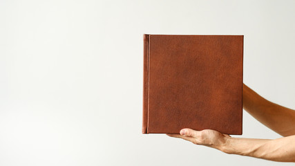 Mock up design templates. photo album in hand