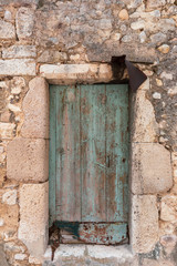 old door of an abandoned house in a medieval village in the South of France