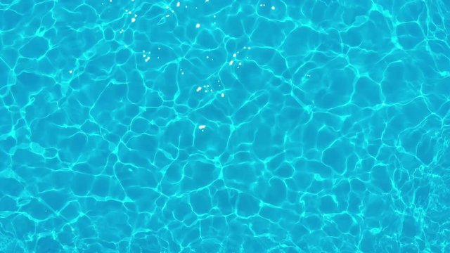 Pool with Blue Water. Water Surface Texture. Top view. Background of Ripples and Wave,