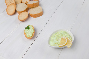 avocado sauce with croutons on wooden background restaurant proper food vegetarianism photo