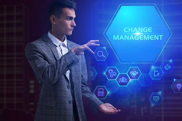 The concept of business, technology, the Internet and the network. A young entrepreneur working on a virtual screen of the future and sees the inscription: Change management