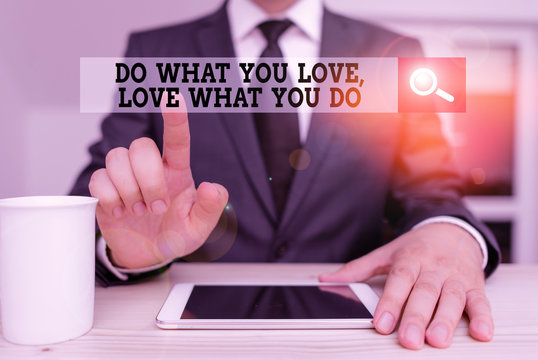 Conceptual hand writing showing Do What You Love Love What You Do. Concept meaning Pursue your dreams or passions in life Male human wear formal clothes present use hitech smartphone