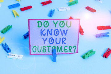 Writing note showing Do You Know Your Customer Question. Business concept for service identify clients with relevant information Colored clothespin papers empty reminder blue floor officepin