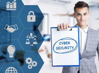 Business, technology, internet and network concept. Young businessman shows a keyword: Cyber...