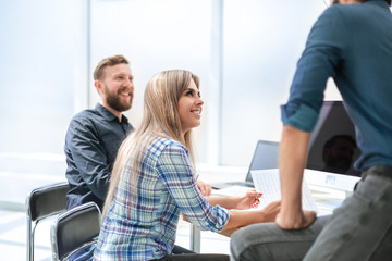 Fototapeta premium young employee discussing business documents with colleagues