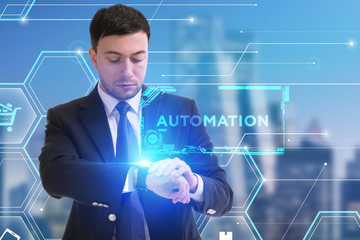The concept of business, technology, the Internet and the network. A young entrepreneur working on a virtual screen of the future and sees the inscription: Automation