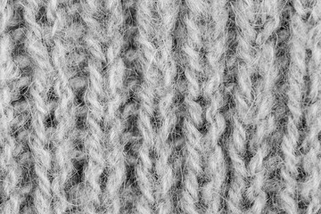 White natural texture of knitted wool textile material background. White cotton fabric woven canvas texture