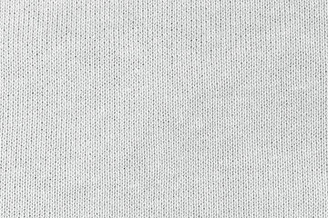 White natural texture of knitted wool textile material background. White cotton fabric woven canvas...