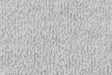 White natural texture of knitted wool textile material background. White cotton fabric woven canvas texture