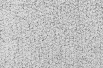 White natural texture of knitted wool textile material background. White cotton fabric woven canvas texture