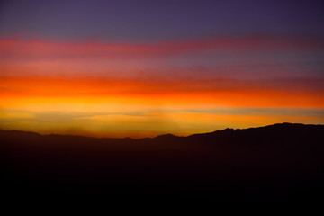 Mountains and skies before sunrise in the morning are covered by a lot of mist.