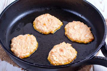 Pumpkin pancakes with honey in a pan