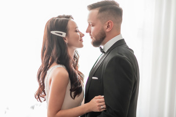 close up. happy bride and groom looking at each other