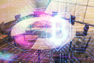 Blockchain theme hologram on conference room background. Double exposure. Concept of cryptocurrency