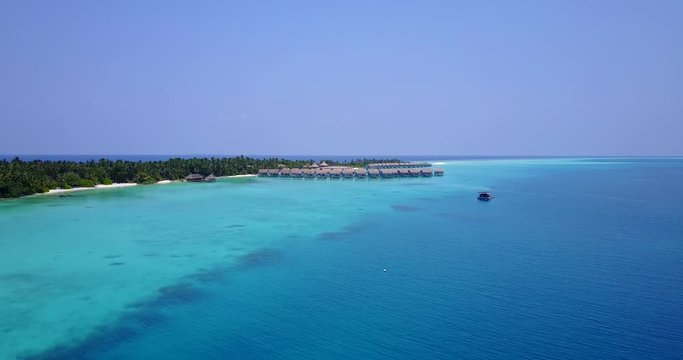 Island in the heart of Madagascar seas - luxury blue island life $K Aerial shot