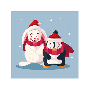 penguin and rabbit with hat and scarf in winter landscape