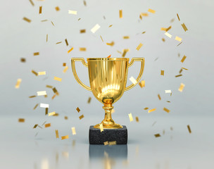 Fototapeta na wymiar Gold winners trophy, champion cup with falling confetti