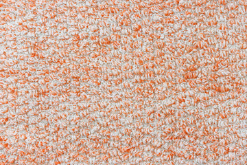 Texture of orange knitted textile material background