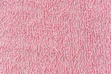Texture of pink knitted textile material background