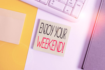 Text sign showing Enjoy Your Weekend. Business photo showcasing wishing someone that something nice will happen at holiday Empty blank paper with copy space and pc keyboard above orange background