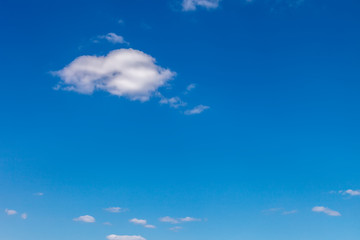 Blue sky with white clouds as a background