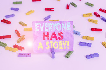 Writing note showing Everyone Has A Story. Business concept for account of past events in someones life or career Colored clothespin papers empty reminder white floor background office
