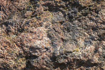 Old cracked stone wall as a background