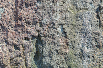 Old cracked stone wall as a background