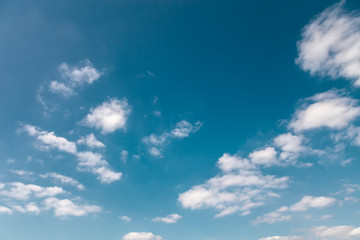 Blue sky with white clouds as a background