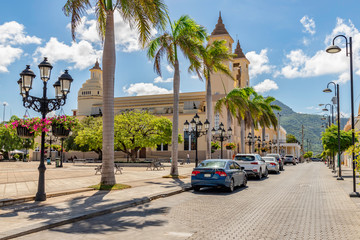Caribbean old city street, church, independence square, tropical plants , palm tree, mountain view, Puerto Plata, Dominican Republic