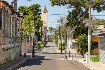 Caribbean old town street, church, independence square, tropical plants, Puerto Plata, Dominican...