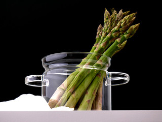 Fresh asparagus on black background
