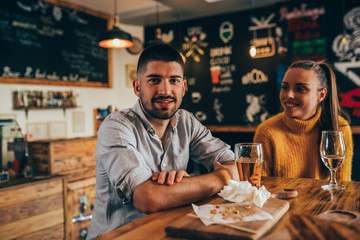couple having fun eating in food corner bar
